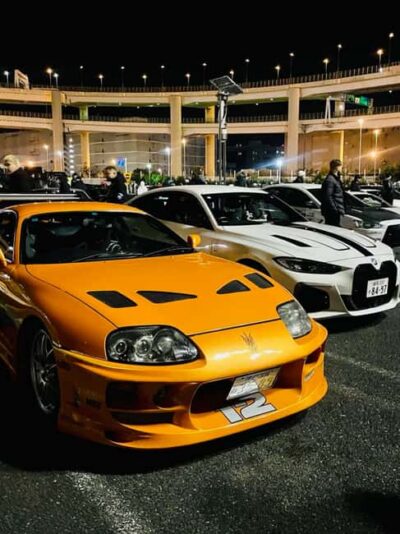 Tokyo: Daikoku Car Meet Experience on a JDM TUNED SPORTS CAR - The night cruise vibe: neon streets and a real convoy